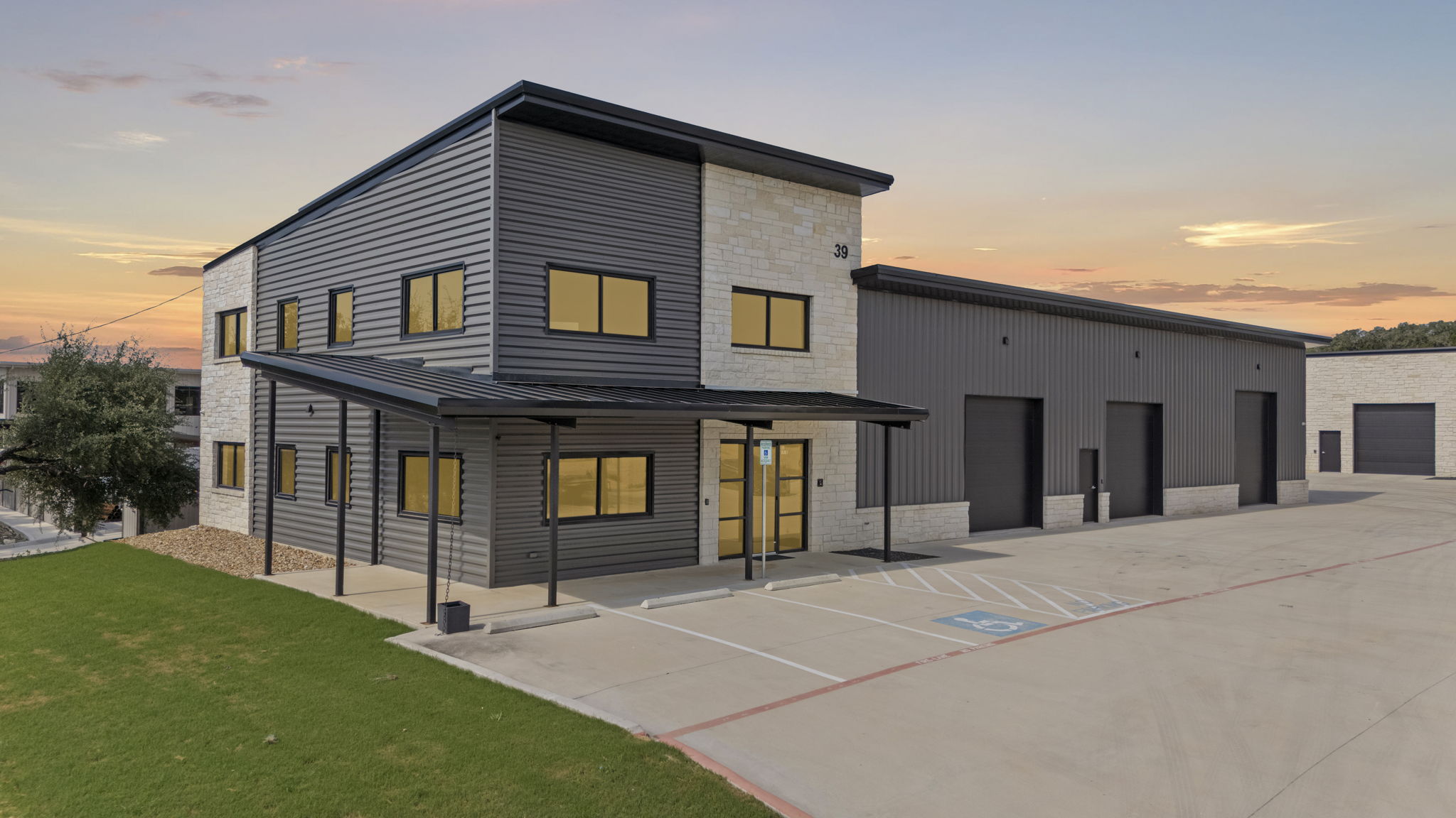 39 Truss Drive luxury automotive compound exterior at sunset, Boerne Texas
